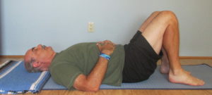 Hands gently resting on belly teaches us to feel expansion on the in-breath.